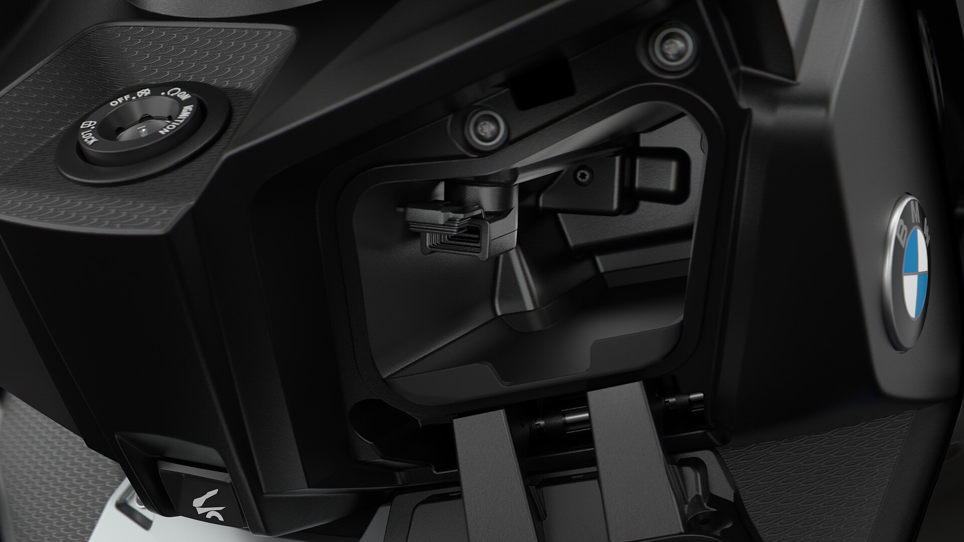 We see the USB charging socket in the storage compartment of the C 400 X.